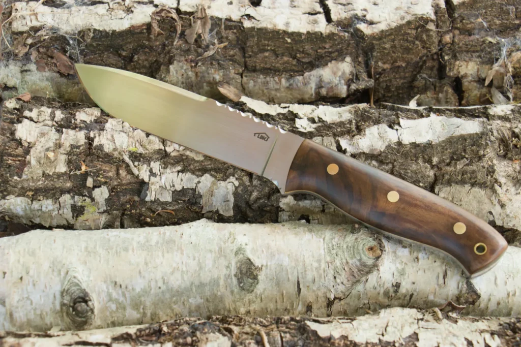 Bespoke Knife 10 handmade bushcraft knife with gunstock walnut handle scales, decorative spine filework and brass pins